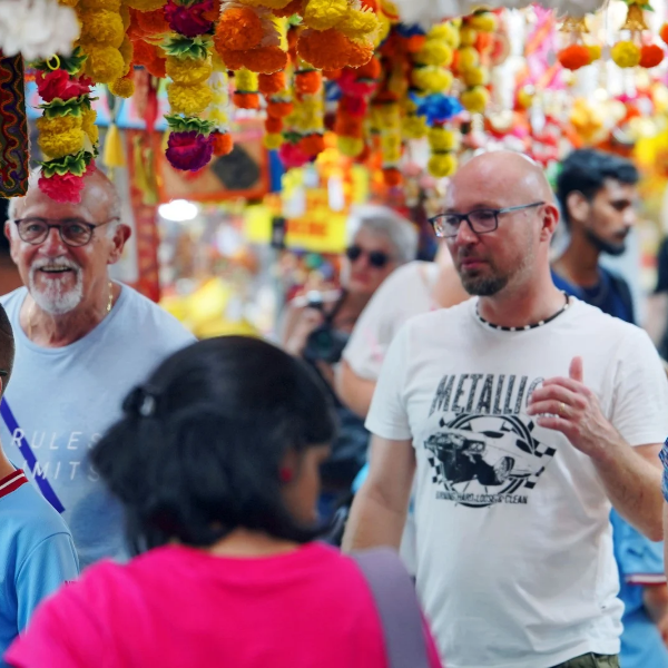 Shoppers browsing festive garlands and stalls at the Deepavali Festival Village on Campbell Lane